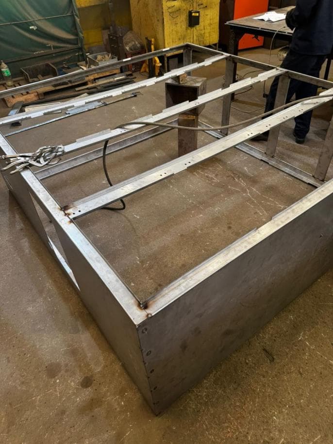 Welded steel enclosure frame in the workshop